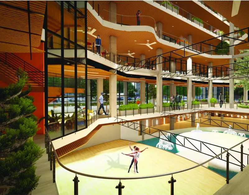 Interior atrium with tiered balconies, timber slatted ceilings and circular performance space with two dancers