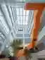 JC Design Threads a Breathing Atrium and Orange Staircase Through a Huizhou R&D Building
