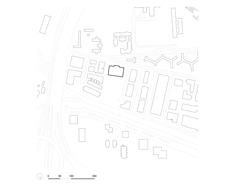 Site plan drawing showing building footprint within the surrounding urban block and adjacent streets