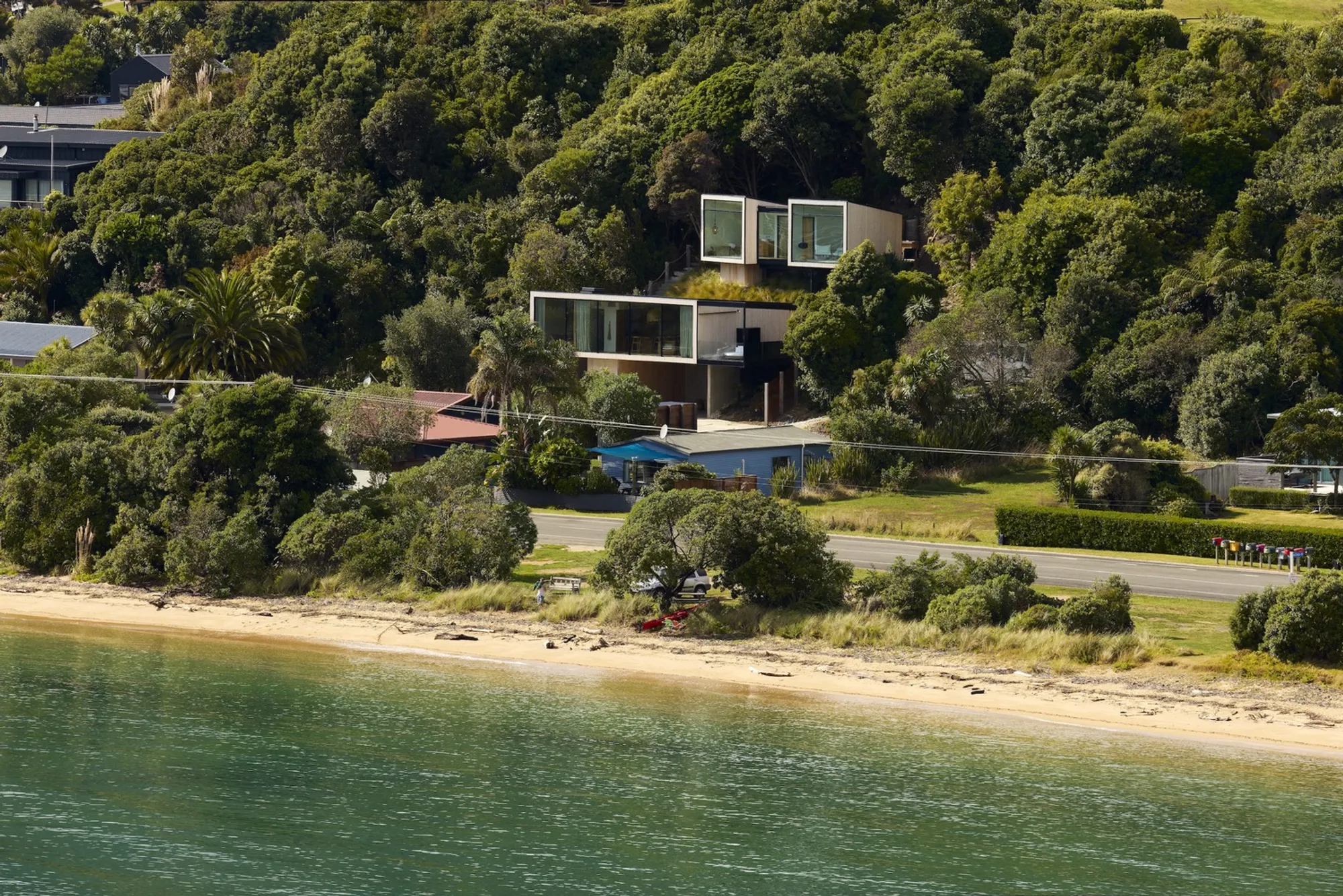 Young Architects Perch a Pavilion Treehouse on a Steep New Zealand Coastline