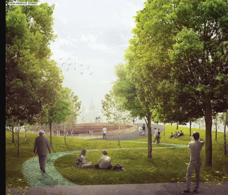 View through mature trees toward the low earthwork structure with visitors on pathways and lawn