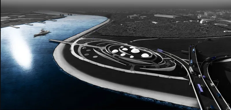 Aerial view of the spiraling roof with circular skylights set into the waterfront landscape at dusk