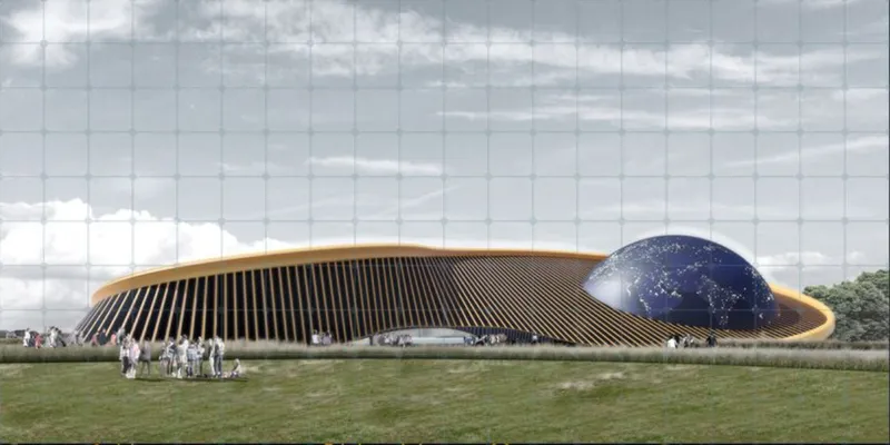 Long view of the low-slung ribbed building with its blue dome under partly cloudy skies