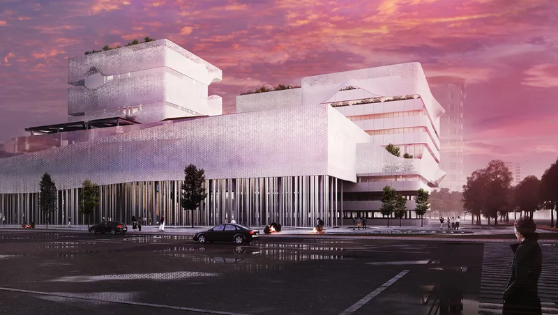 Street level view of the perforated white facade base and stacked volumes under a vibrant purple sunset sky