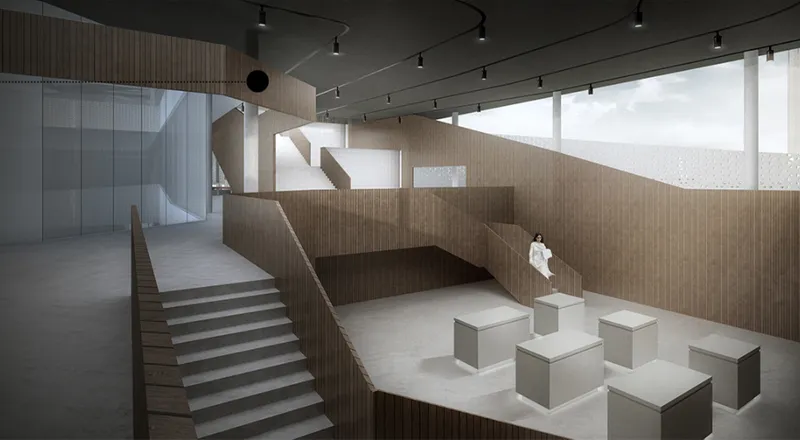 Interior gallery space with timber-clad stepped walls, floating staircase, and sculpture plinths under track lighting