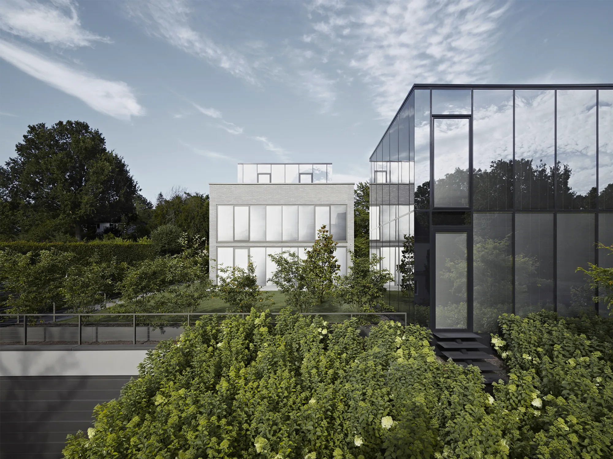 House E by CHRIST.CHRIST. Associated Architects: A Harmonious Blend of Reflection and Materiality