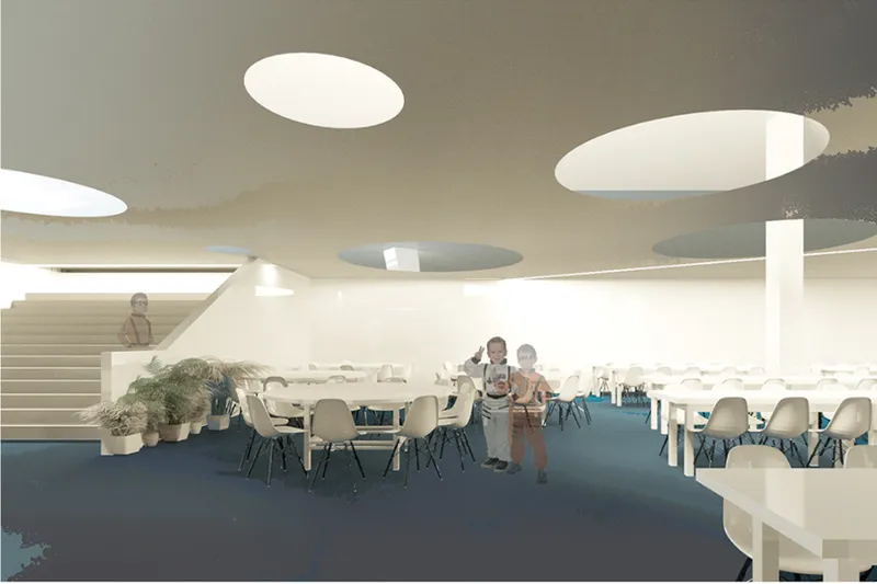 Interior library space with circular ceiling openings, blue carpet and reading tables beneath indirect cove lighting