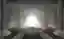 The image depicts an architectural rendering of a cemetery interior, characterized by a modern and m