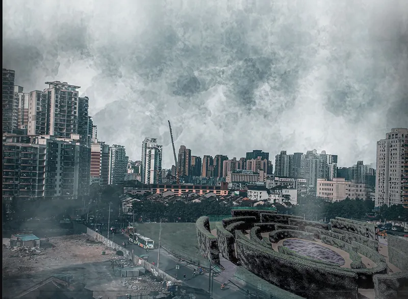 Aerial view of the circular sunken plaza surrounded by terraced landscape and high-rise buildings under stormy skies