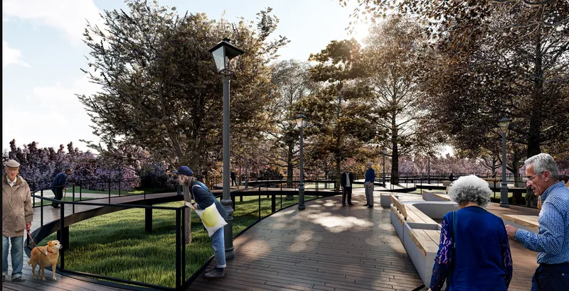 Timber platform with integrated benches and black railings as visitors gather at dusk beneath mature trees