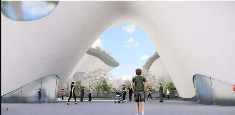 Interior view through a large arched opening framing visitors and landscaped gardens beyond under blue sky