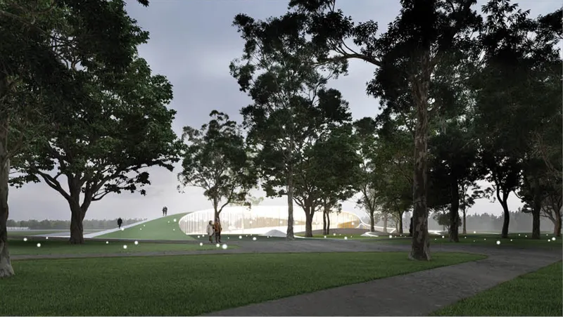 Illuminated glass pavilion glowing among mature trees in a park at dusk with ground lights dotting the lawn