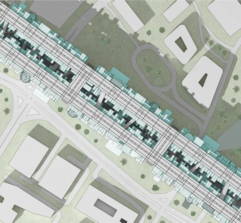 Site plan showing linear housing blocks alongside rail infrastructure with adjacent green spaces and existing buildings