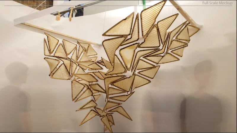 Underside of geometric ceiling installation with folded chitosan panels suspended from white surface