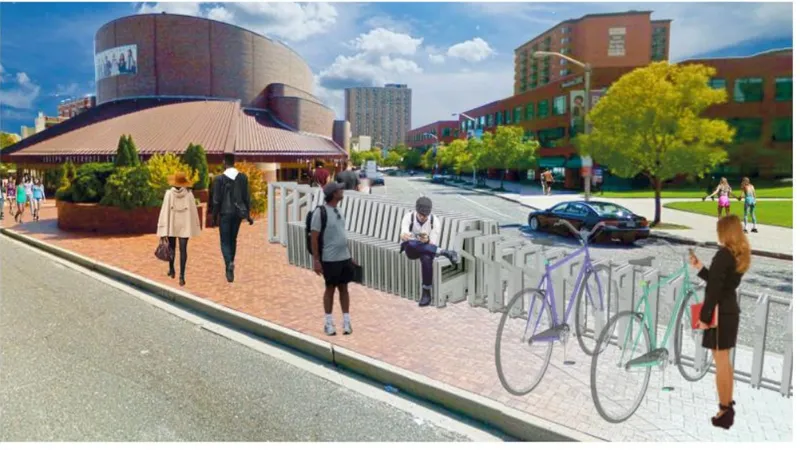 Street corner with white slatted furniture, bike racks, pedestrians, and cylindrical brick building in background