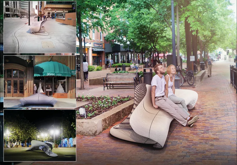 Two people seated on a curved bench along a tree-lined pedestrian street during daytime