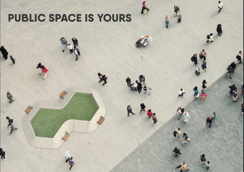 Aerial view of the cloverleaf plaza with green turf insert surrounded by pedestrians on pavers