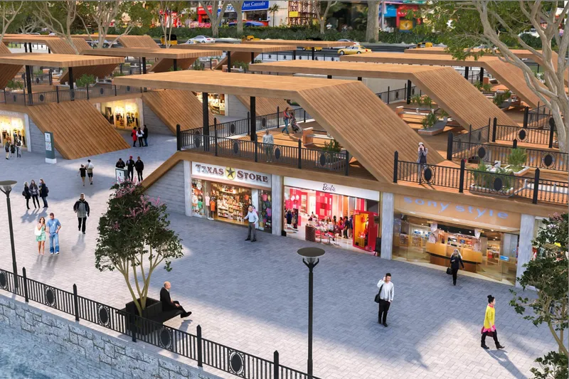 Retail plaza with sloping timber roofs and shopfronts viewed from an elevated walkway at dusk