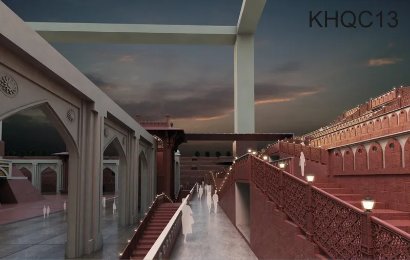 Elevated walkway flanked by red sandstone walls and white colonnades at twilight