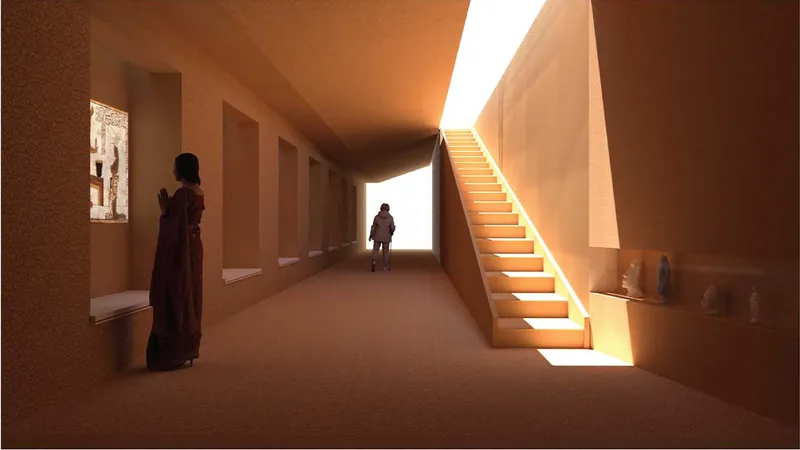 Interior corridor with terracotta walls and a sunlit staircase rising on the right beneath an angled ceiling