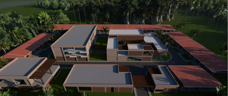 Aerial view of the compound showing flat-roofed volumes arranged around courtyards with lawns and palm trees