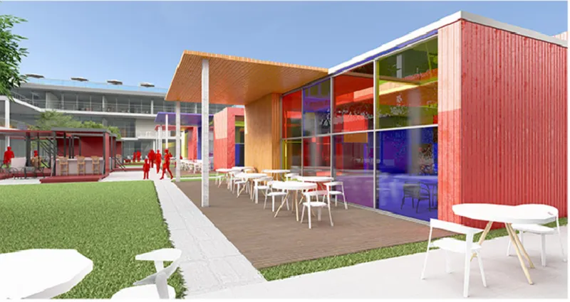 Courtyard pavilion with corrugated cladding, yellow soffit, and outdoor dining tables on the lawn