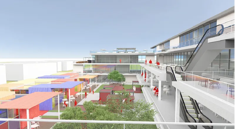 White walkway with escalator overlooking colored pavilions and planted areas in the central courtyard