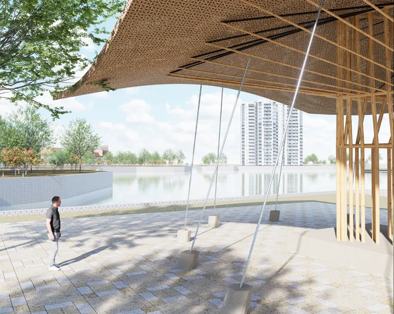 Pavilion with woven bamboo roof and exposed timber structure framing a view of the waterfront with a figure on a swing