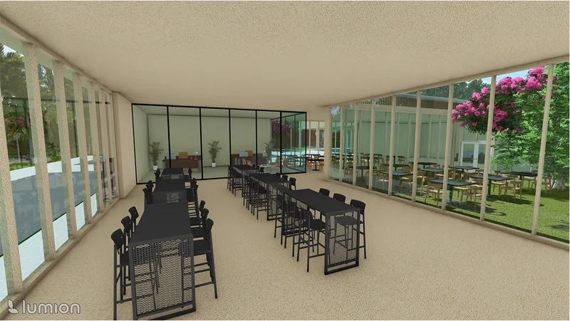 Interior dining hall with black tables and chairs framed by floor-to-ceiling glass walls opening to greenery