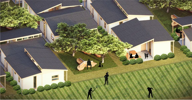 Aerial view of clustered gabled volumes with dark roofs surrounding a shared lawn and tree