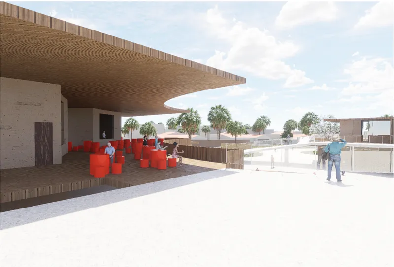 Covered terrace with patterned timber soffit, concrete walls, red seating elements and palm trees beyond
