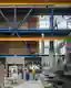 This architectural image showcases the interior of a modern industrial facility. The space features 