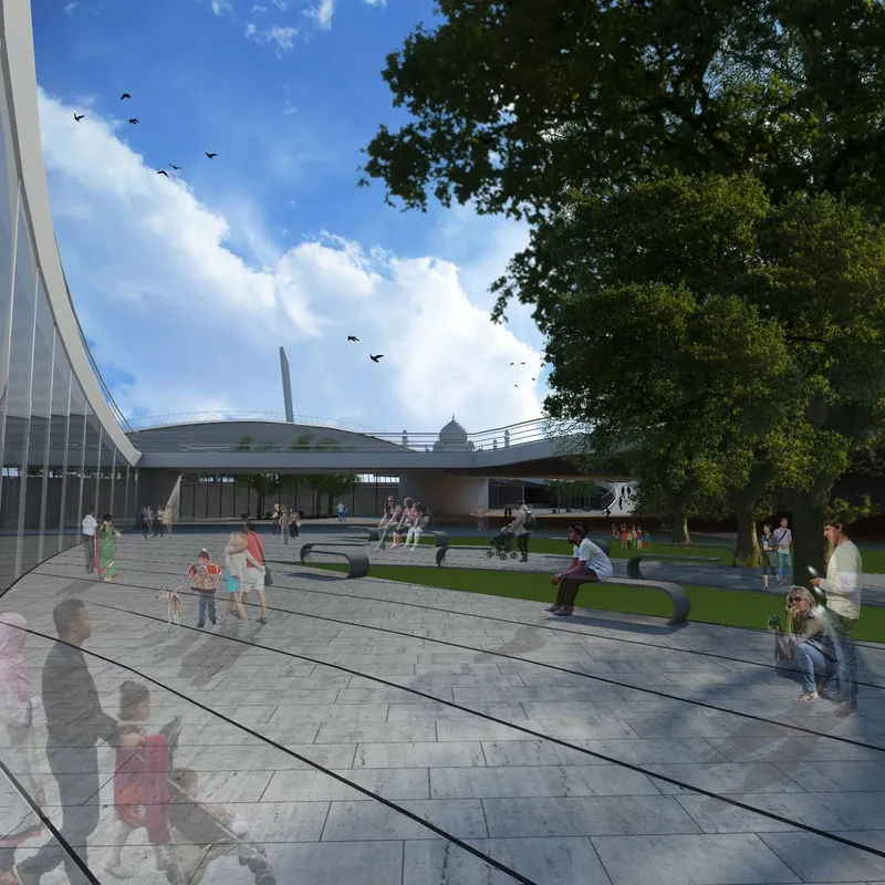Exterior plaza with curved low-rise pavilion roof and families relaxing on benches under a blue sky