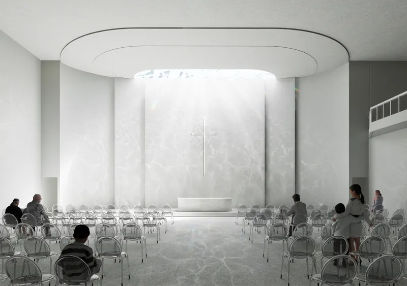 Interior sanctuary space with circular skylight above the altar and translucent curved wall behind the cross