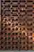 The image showcases a brick facade with a distinctive openwork pattern. The bricks are arranged in a