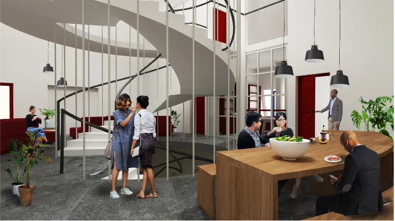 Double-height common room with spiral staircase and residents at timber dining table