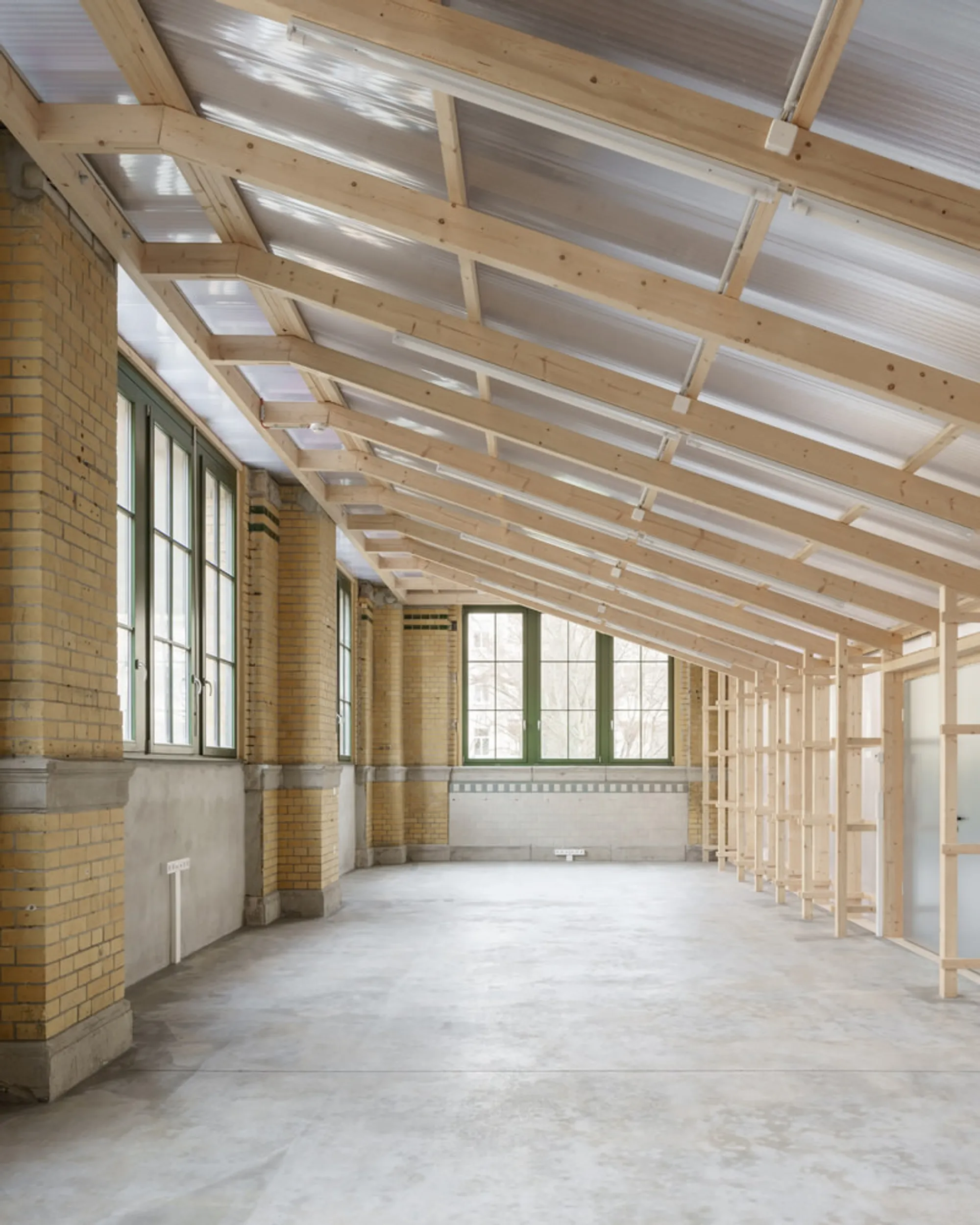 KO/OK Architektur Slots Two Translucent Timber Boxes into a 1910 Leipzig Machinery Hall for €80,000