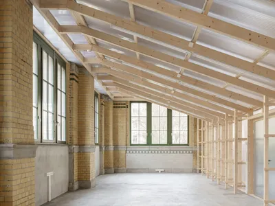 KO/OK Architektur Slots Two Translucent Timber Boxes into a 1910 Leipzig Machinery Hall for €80,000