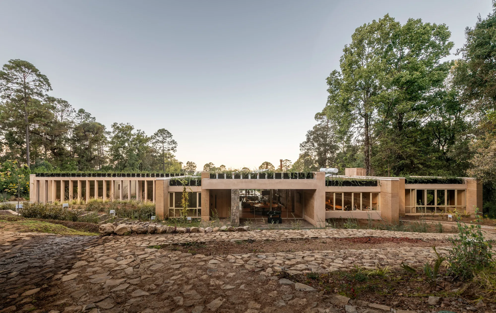 KM House: A Contemporary Sanctuary Crafted from Earth, Concrete, and Light