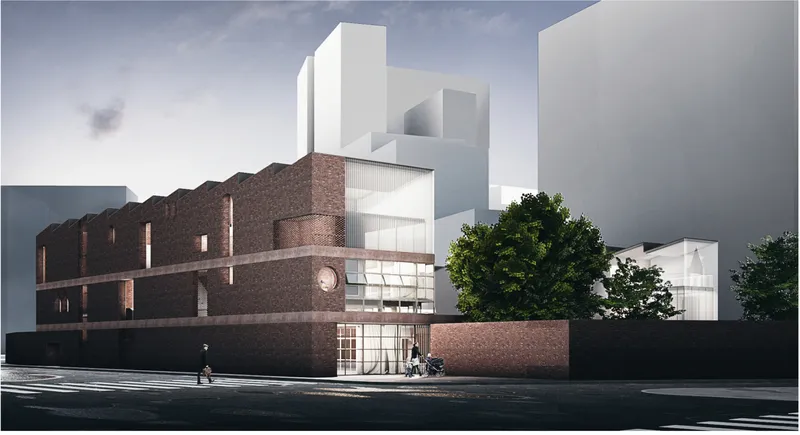 Street view of renovated brick facade with new white corrugated upper volume and pedestrians crossing