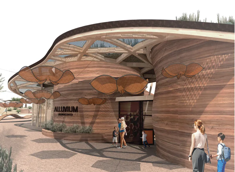 Entrance facade with layered timber cladding and scalloped canopy elements sheltering visitors in the desert landscape