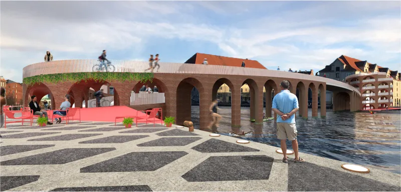 Arched brick bridge with planted rooftop and patterned paving plaza where pedestrians gather along the waterfront