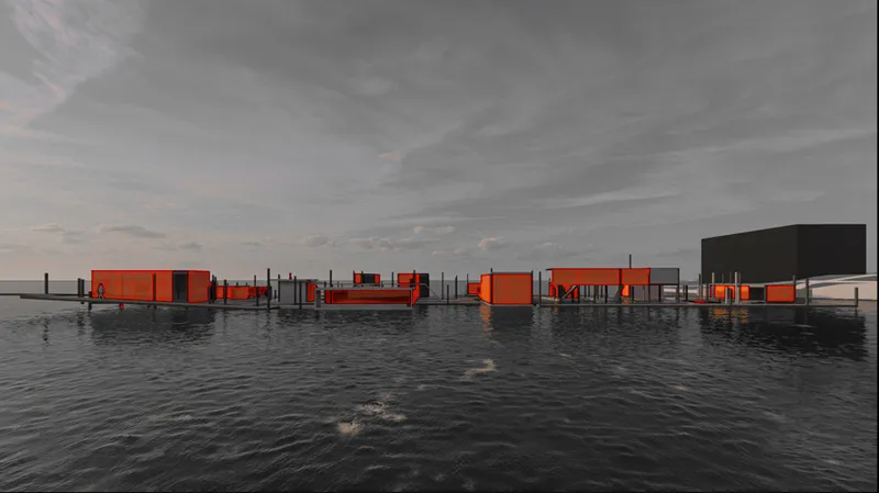 Wide view of dispersed orange and grey pavilions on stilted platforms across still water at dusk