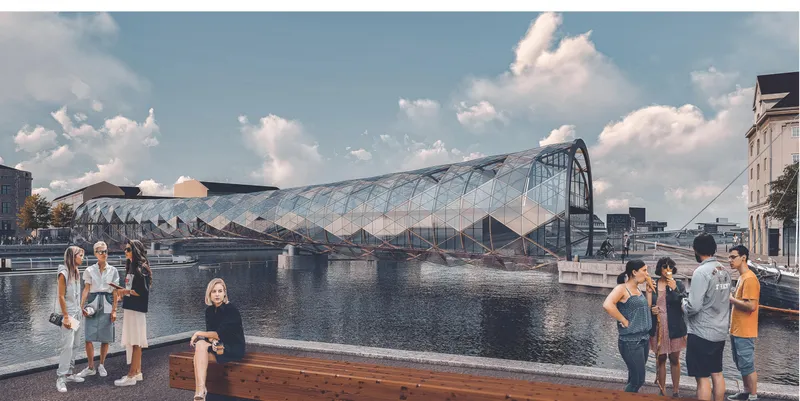 View of the undulating glass and steel pedestrian bridge spanning the harbor with visitors on the waterfront promenade