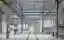 This architectural image showcases the interior of an industrial building, likely a factory or wareh