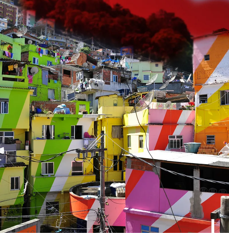 Close view of painted concrete houses in green, yellow, orange, and pink with overhead power lines