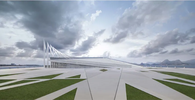 Wide view of the linear white structure with triangular roof fins stretching across striped green lawn under dramatic clouds