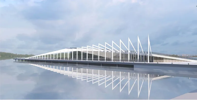 Long waterfront structure with repeating white triangular columns reflected in still water under overcast sky