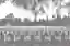 The image depicts a grayscale view of a cemetery with rows of headstones stretching into the distanc