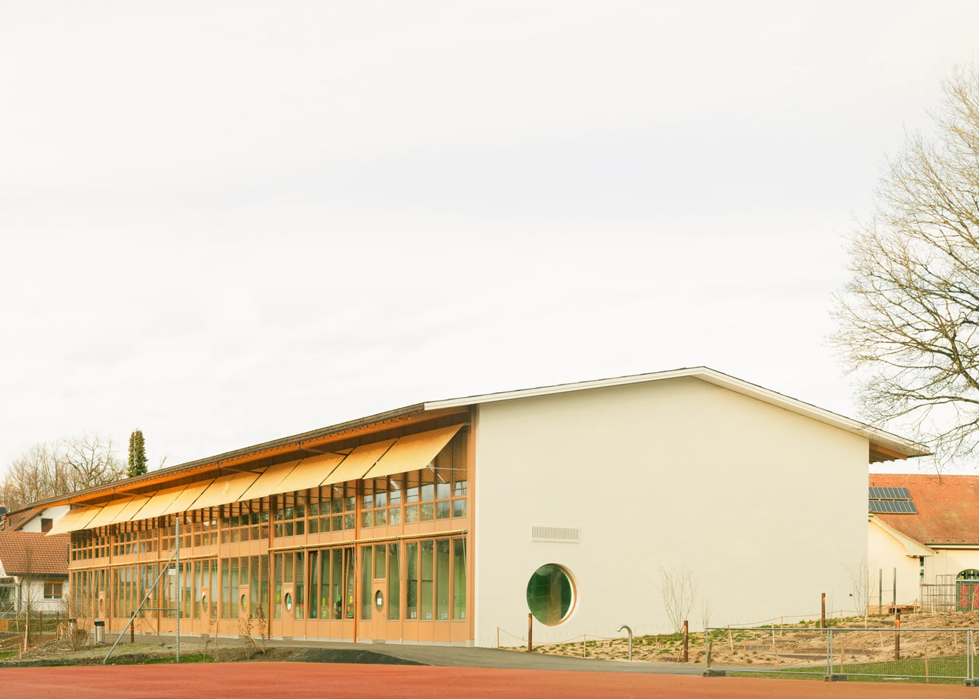 Aaberg School by Haller Gut Architects: A Harmonious Dialogue Between Timber Architecture and Nature